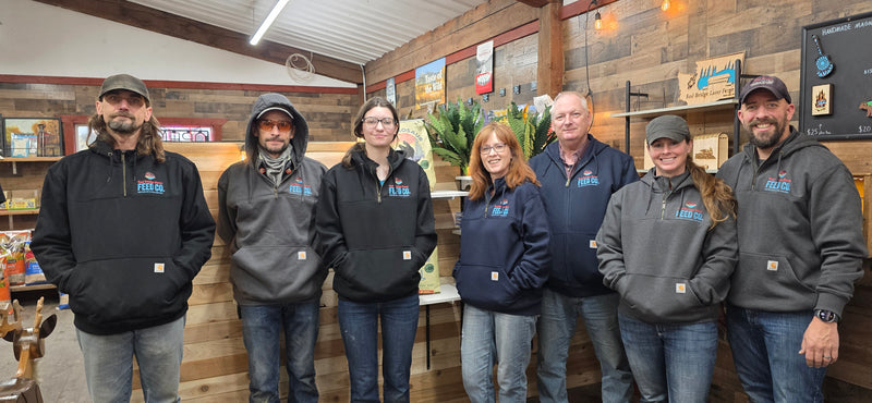 Seven members of the Red Bridge team standing together in the store