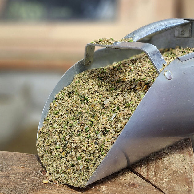 A scoop of fresh-milled mash